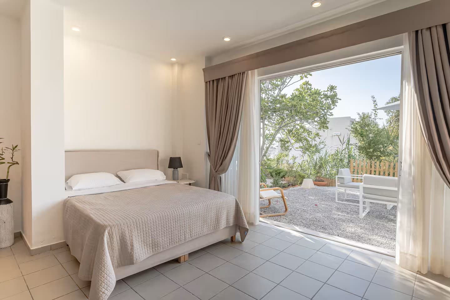 The bedroom, made up with white linen