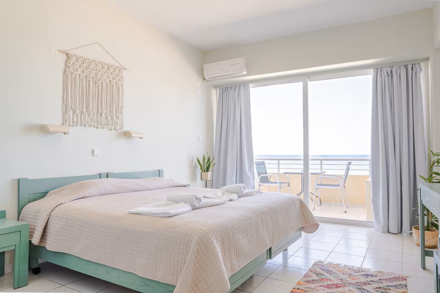 The bedroom, made up with white linen